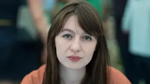 Sally Rooney claims she will not enter the UK because of arrest fears